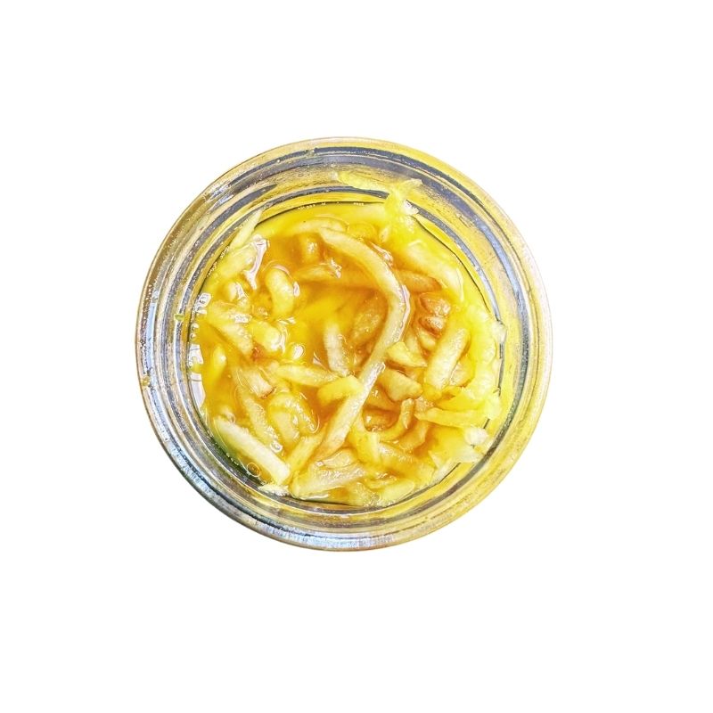 Jar of Living Lacto-Fermented Golden Beetroot with Kaffir Lime Leaf on a white background