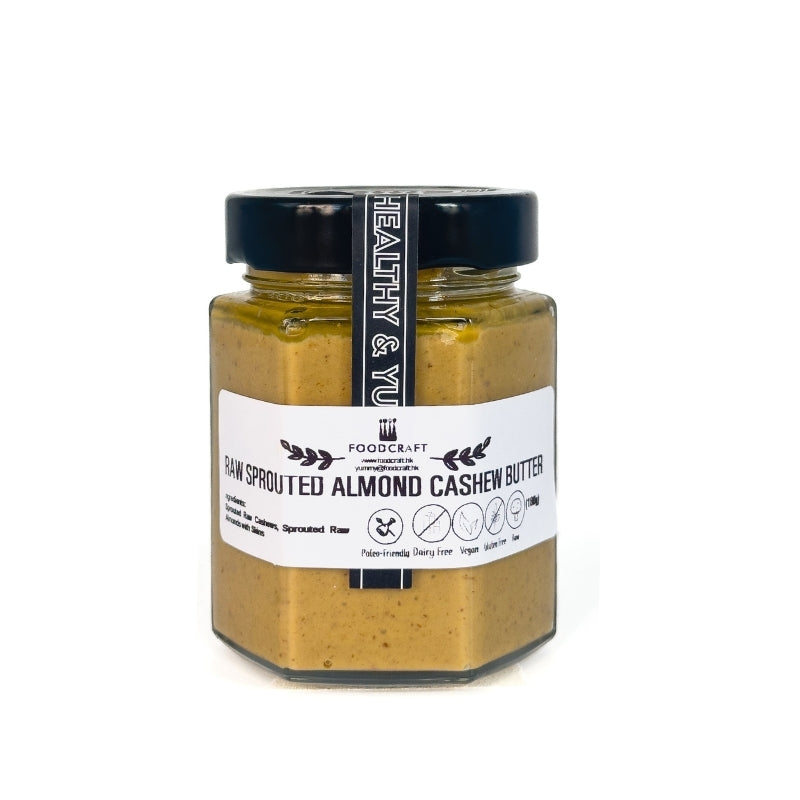 Jar of raw sprouted almond cashew butter with a visible label on a white background