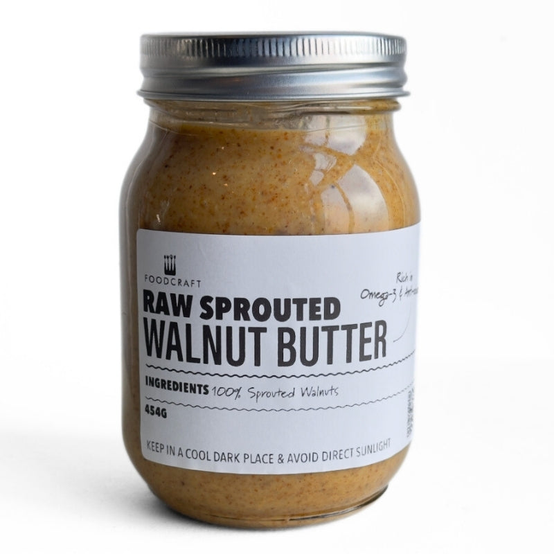 Jar of raw Raw_Sprouted_Walnut_Butter_454g with a label on a white background